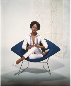 "YOUNG WOMAN SITTING ON ARMCHAIR" FROM GETTY IMAGES